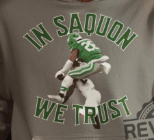 an Eagles shirt shows Saquon jumping over an opponent
